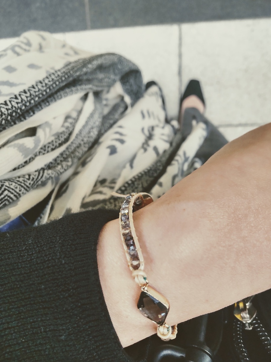 Black outfit with a gray bracelet