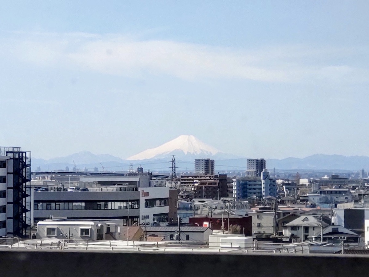 View of Mt. Fuji and snow-covered mountains from the Shinkansen