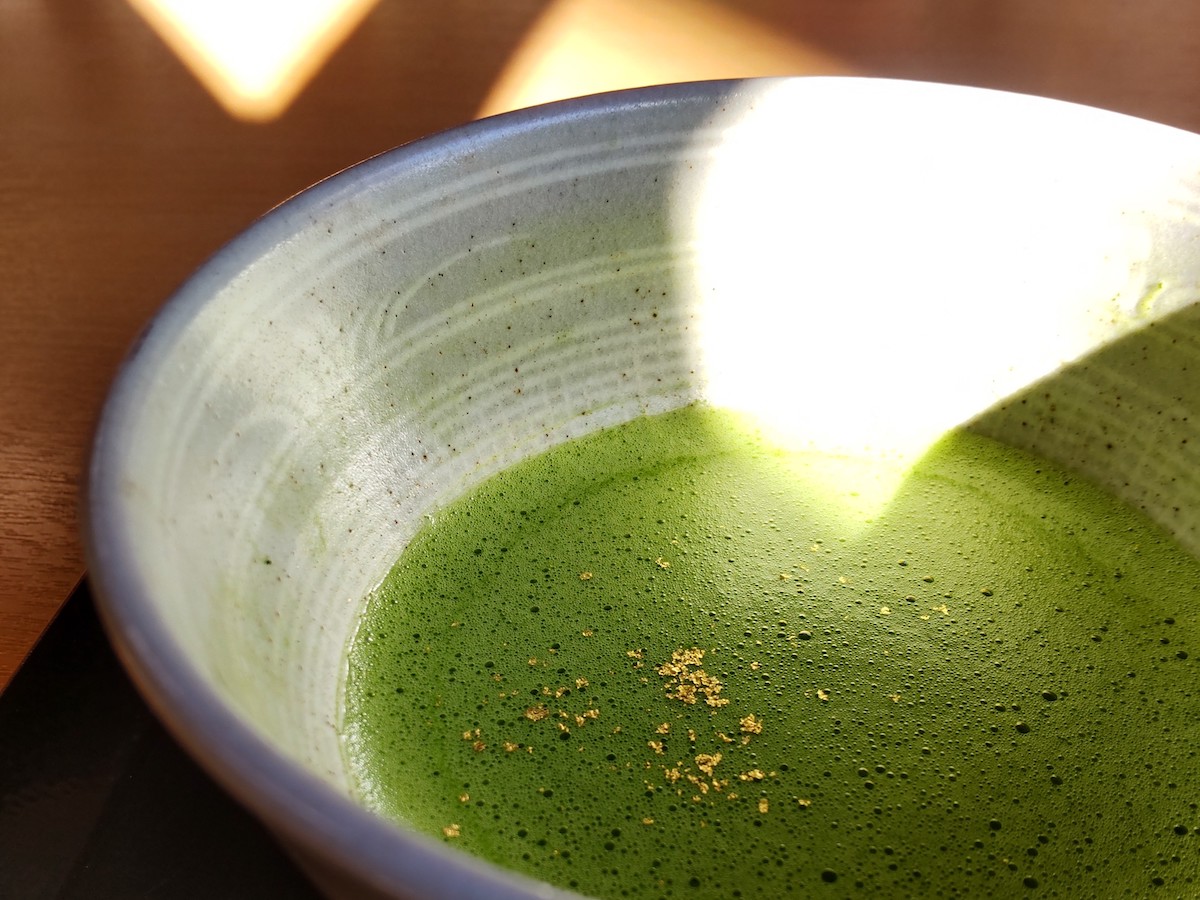Close-up of matcha with a sprinkle of gold flakes
