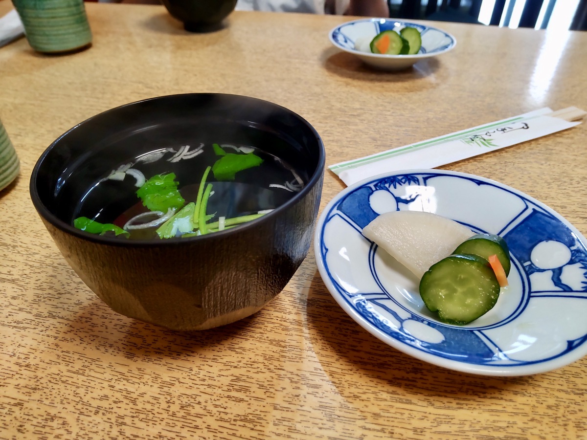 Clear, aromatic soup served with traditional Japanese pickled vegetables in rice bran